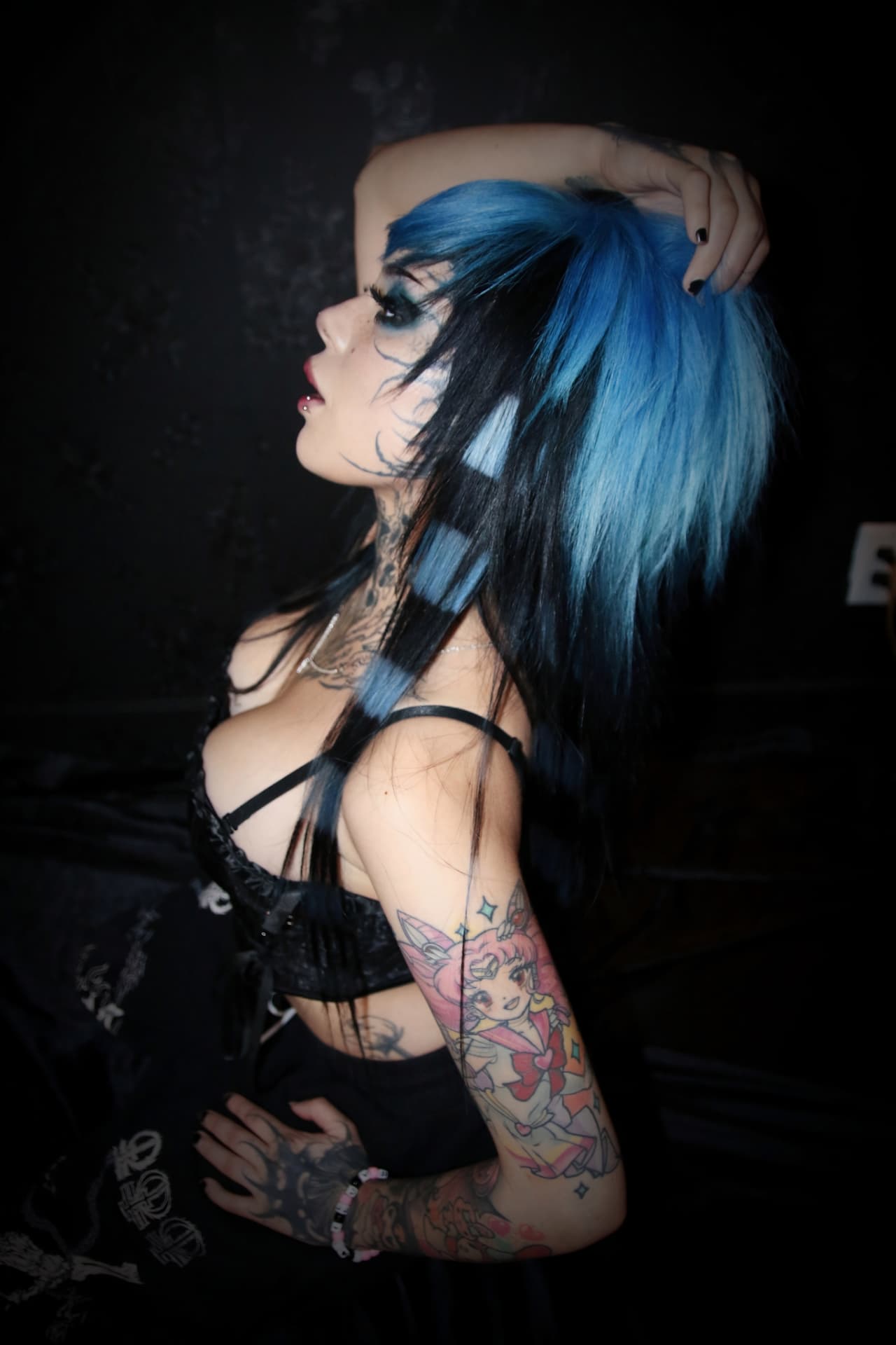 Model with blue and black layered hair styled at Heads Will Roll